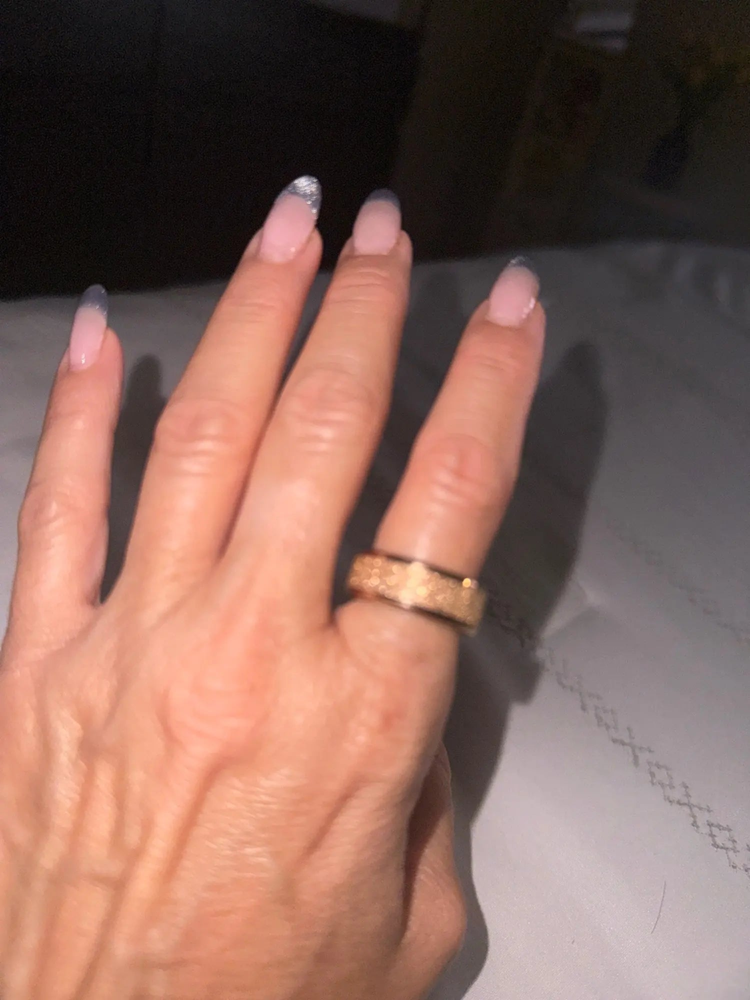 Gold smart ring worn elegantly